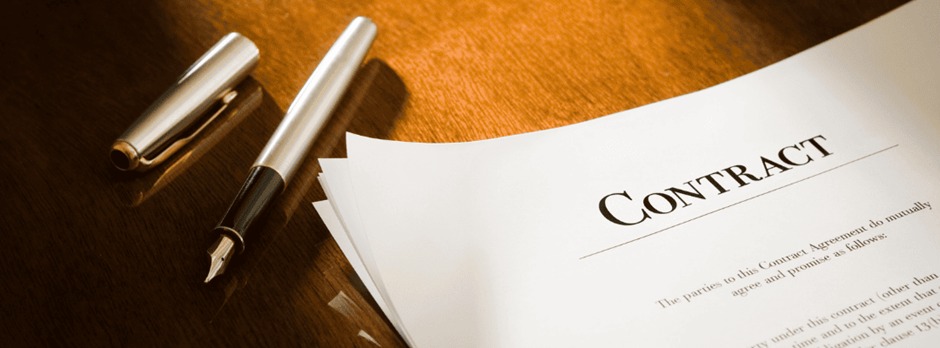 “Doctor reviewing physician agreement to avoid legal mistakes.”