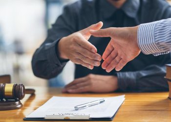 Criminal defense lawyer meeting with a client to discuss legal strategy.